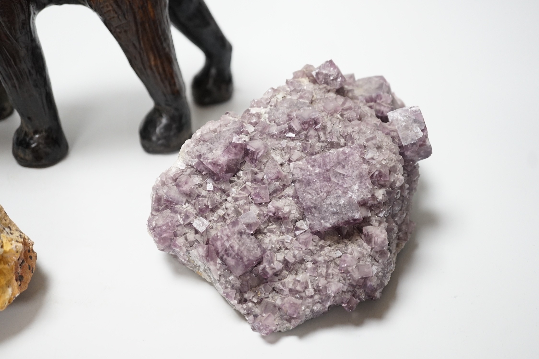 Two specimens; amethyst and rock crystal, and a leather model of an Indian elephant, 24cm high